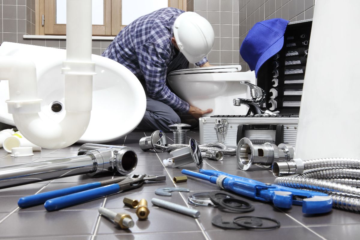Plumber Conducting Toilet Installation