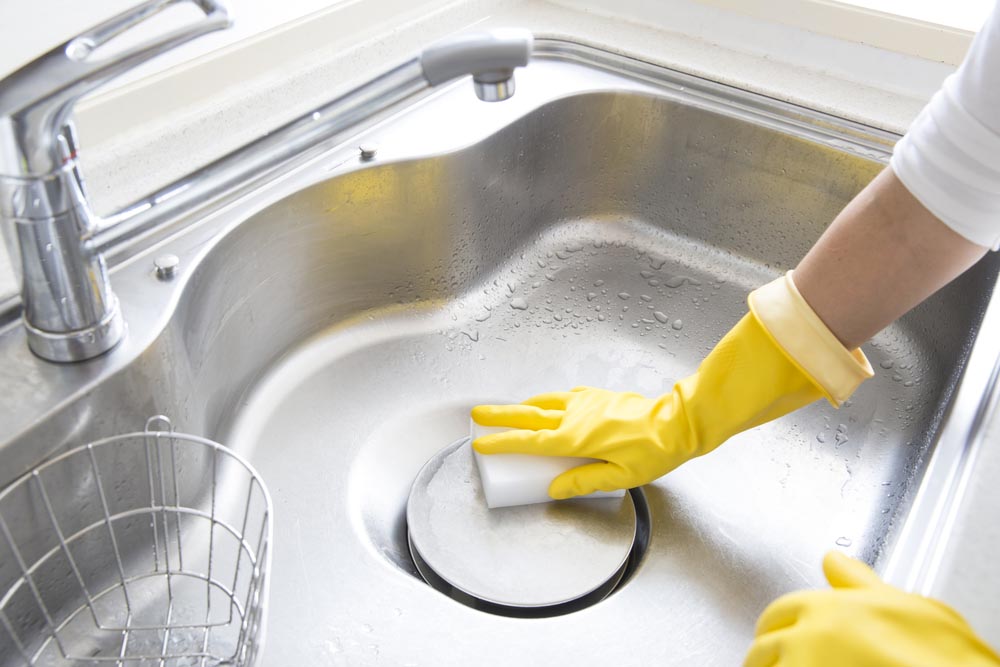 Cleaning kitchen sink Cleaning kitchen sink